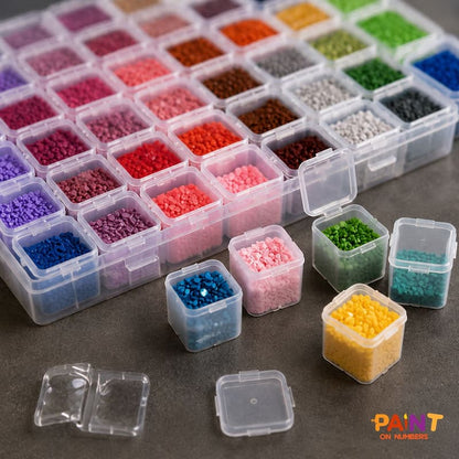 Close-up of a 56 Grid Diamond Storage Box with individual lidded containers filled with colorful diamond painting drills, showing spill-proof compartments for easy color organization.