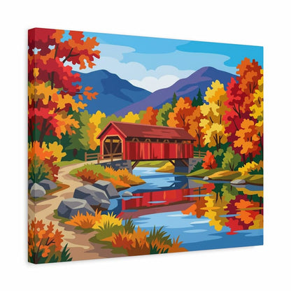 Canvas print of a red covered bridge in a autumn landscape with trees and mountains.