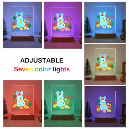 A collage showing a clear rectangular LED night light with a cartoon bunny and Christmas decorations, displayed in seven different adjustable colors. The center text reads 'ADJUSTABLE Seven color lights'.