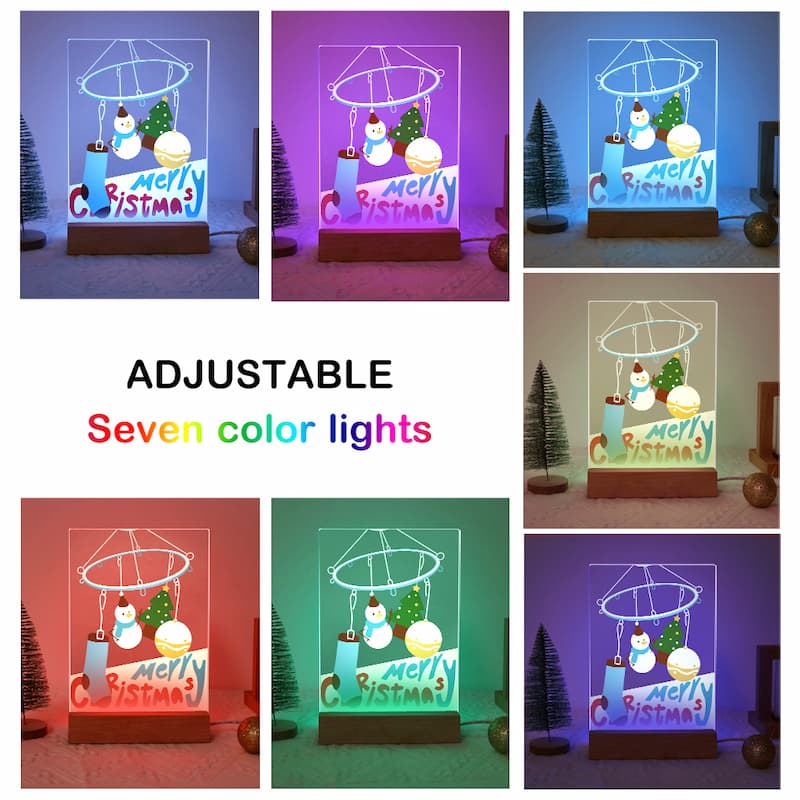 A collage showing a tabletop Christmas light set in seven different colored illumination modes, with text reading 'ADJUSTABLE Seven color lights.' The product appears to be a clear acrylic night light with a wooden base, featuring a snowman, Christmas tree, ornaments, and a 'Merry Christmas' sign.