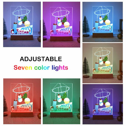 A collage showing a tabletop Christmas light set in seven different colored illumination modes, with text reading 'ADJUSTABLE Seven color lights.' The product appears to be a clear acrylic night light with a wooden base, featuring a snowman, Christmas tree, ornaments, and a 'Merry Christmas' sign.