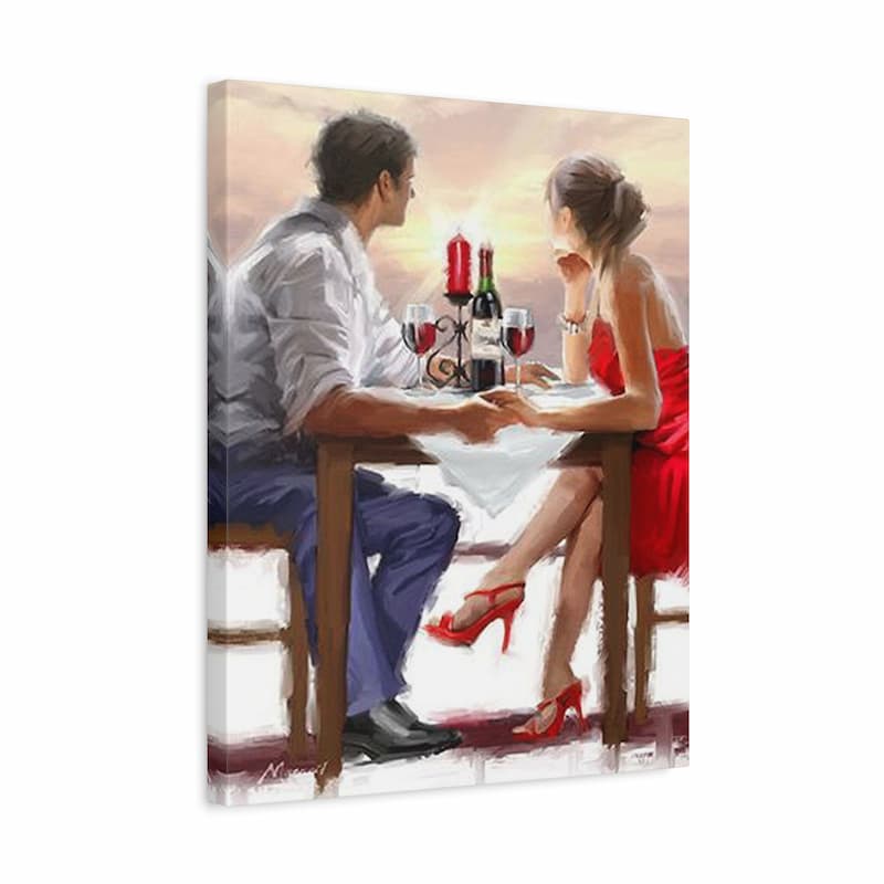 Couple at a romantic dinner setting with candles and wine glasses on a white background