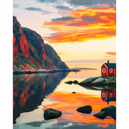 Fishing hut on a small island with a colorful sunset over a mountainous landscape