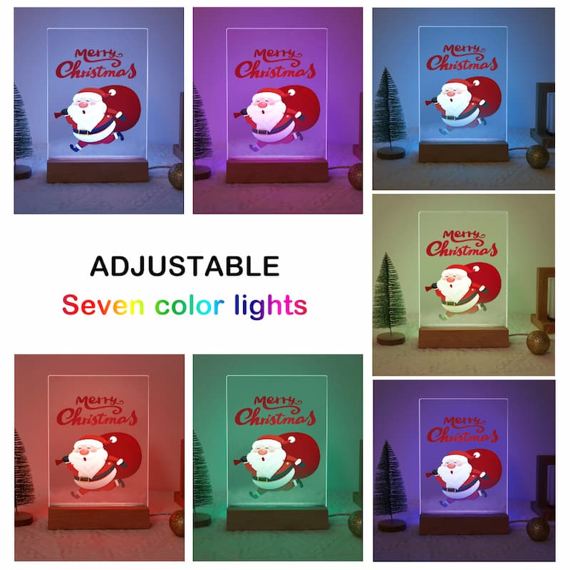 A collage showing the same LED light box in seven different color modes, with Santa Claus artwork on a clear rectangular panel and the words 'Merry Christmas' above it. Large text in the center reads 'ADJUSTABLE Seven color lights.