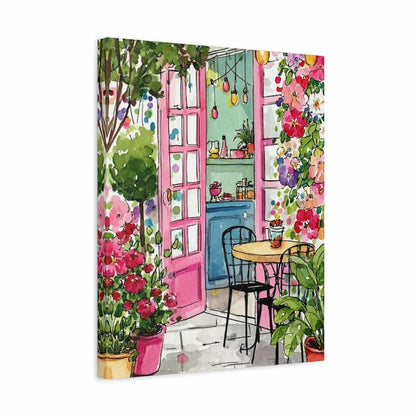 A square canvas wall art print depicting a colorful watercolor-style garden cafe scene with pink doors, flowers, greenery, and a small table and chair, shown against a plain white background.