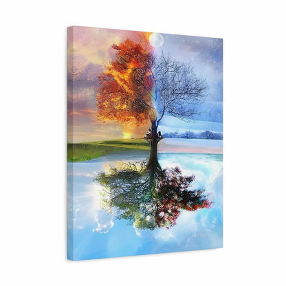 Canvas print of a tree with autumn colors reflected in water, set against a colorful sky.