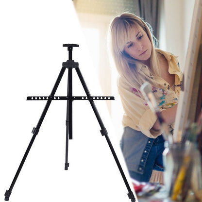 Black adjustable artist easel with a blurred background of a person painting