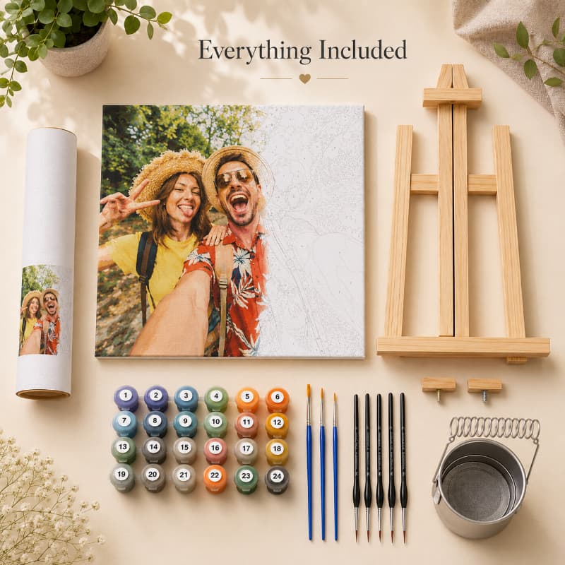 Artistic setup with a photo of two people, paint supplies, and an easel on a beige surface.
