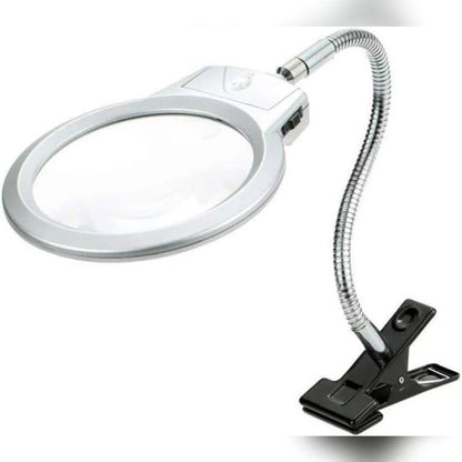 Magnifying glass with flexible arm and clip on a white background