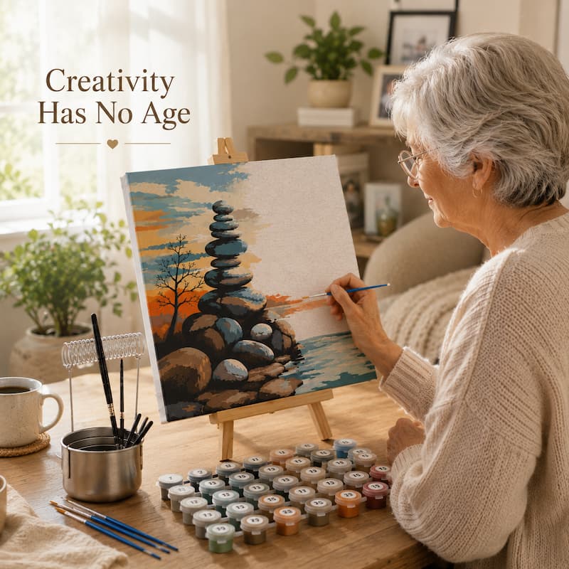 Senior woman painting a landscape with rocks and trees on an easel, with 'Creativity Has No Age' text above.